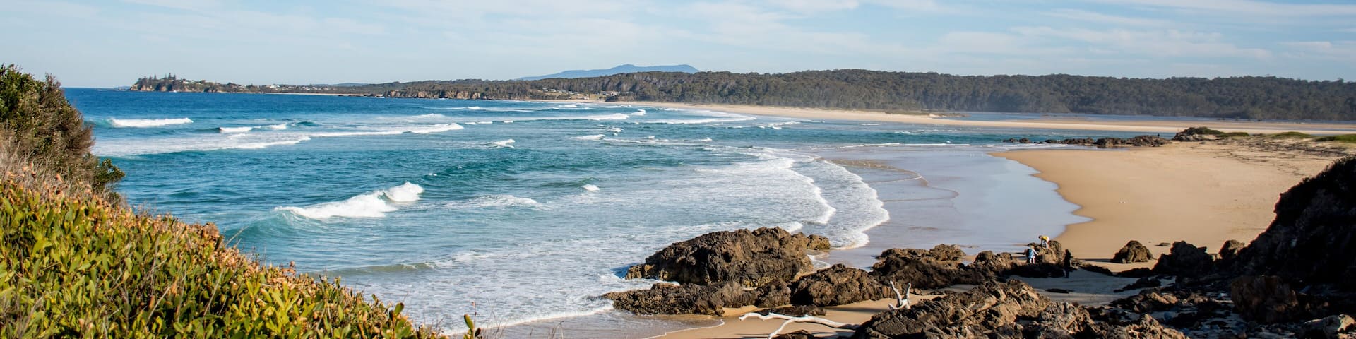 Ocean waves with white foam on a sunny day. Nature tropical paradise background. Tuross Head, NSW, Australia