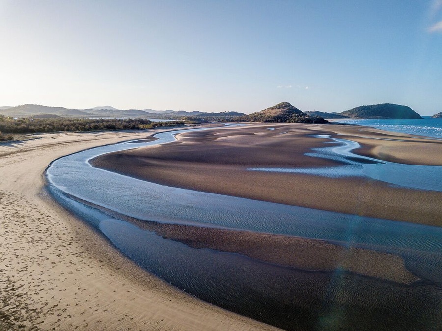 Kinka Beach on the Capricorn Coast of Queensland. the tide goes out here, a loong way.  This image is taken from the South looking North towards Mulumbin Headland.