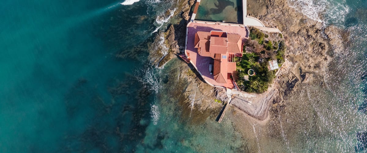 Aerial view of Isola Piccola, a building on a small island in Marzamemi, Pachino, Syracuse, Sicily, Italy.