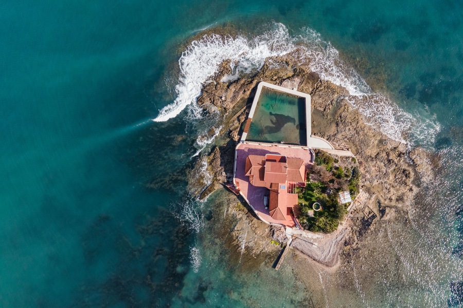 Aerial view of Isola Piccola, a building on a small island in Marzamemi, Pachino, Syracuse, Sicily, Italy.