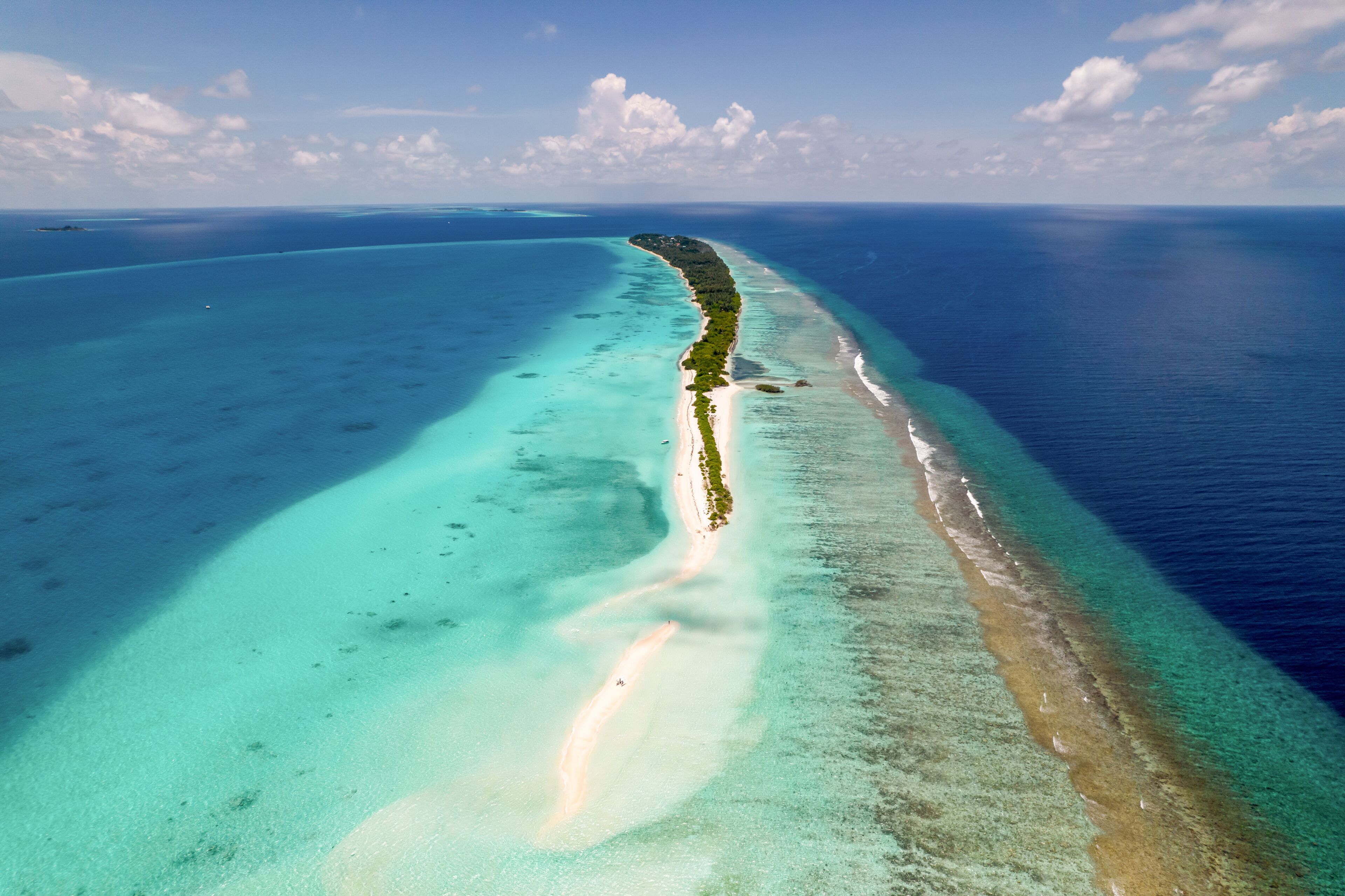 Aerial view of Long Beach Dhigurashu Thundi, a paradise island on Alifu Dhaalu Atoll near Alif Alif, Maldives.