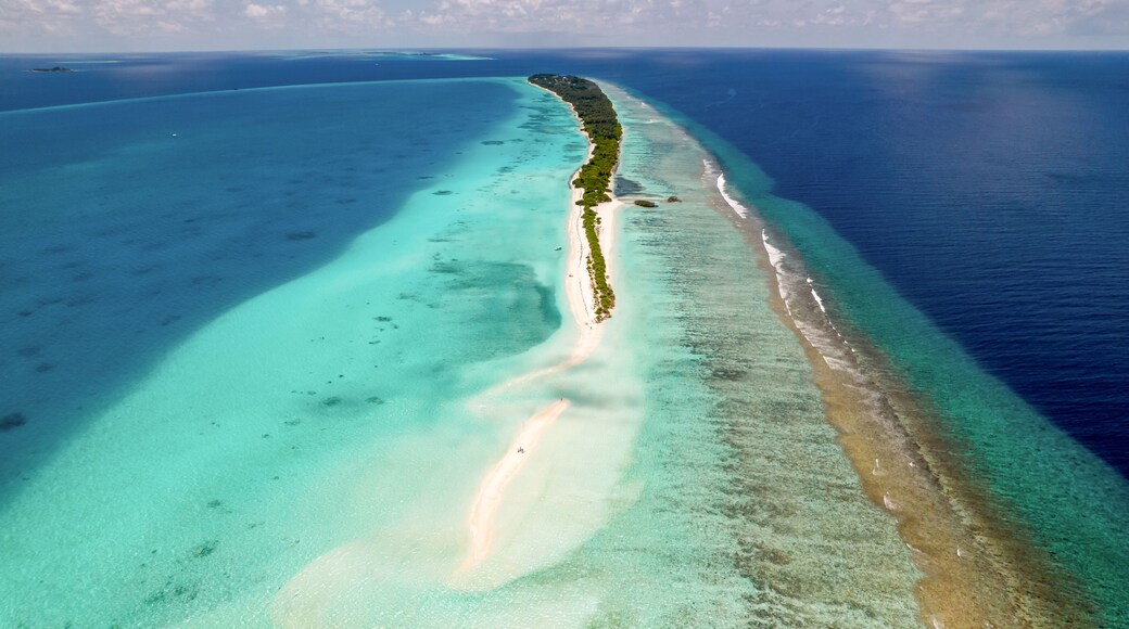 Aerial view of Long Beach Dhigurashu Thundi, a paradise island on Alifu Dhaalu Atoll near Alif Alif, Maldives.