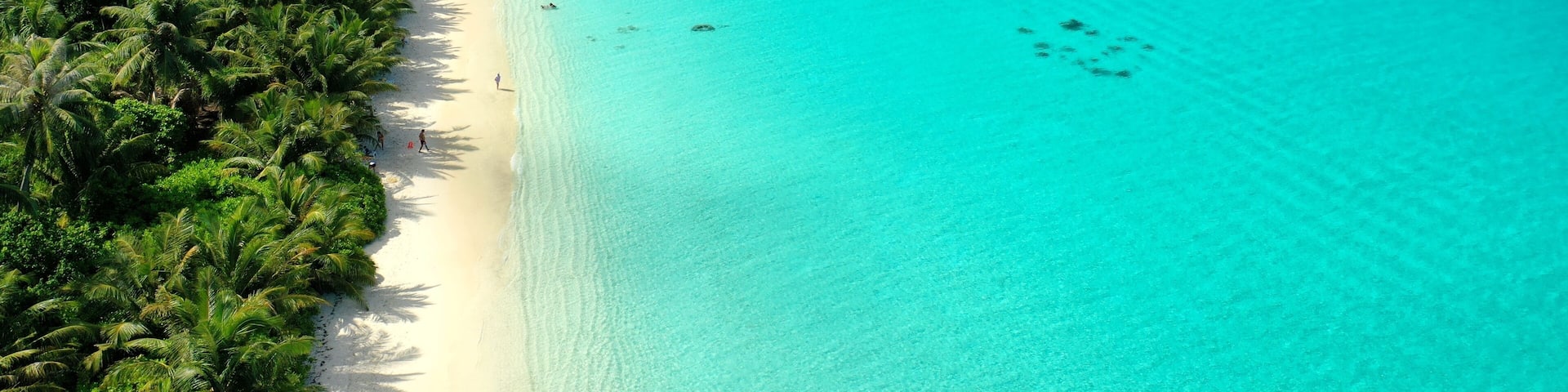 Bird's eye view of tropical islands in the ocean. View of the islands from a drone. Maldives, Thinadhoo (Vaavu Atoll), Dhigurah