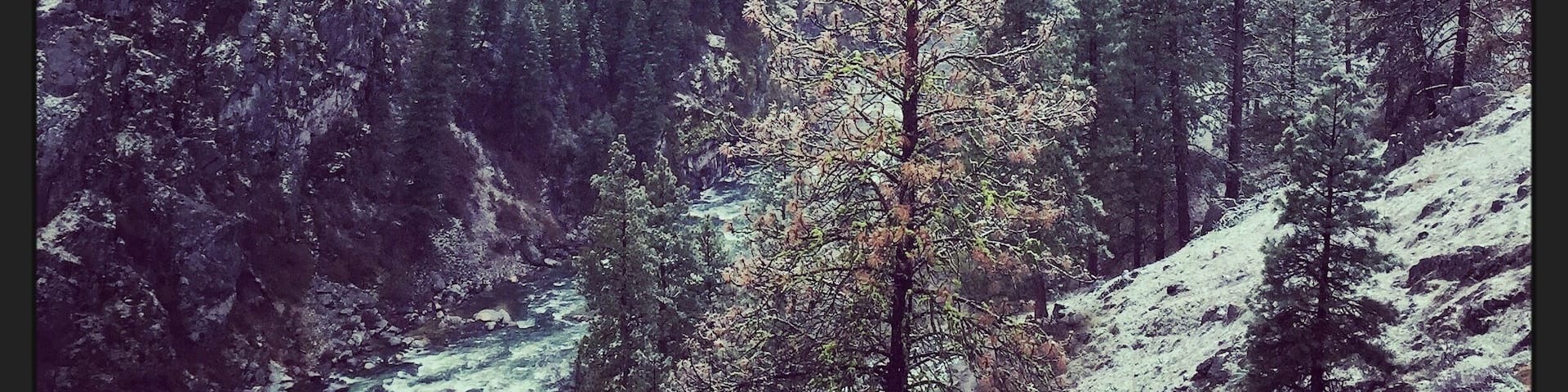 View from Skinny Dipper Hot Springs about a half mile hike up from the highway and South Fork Payette River on a snowy spring morning.