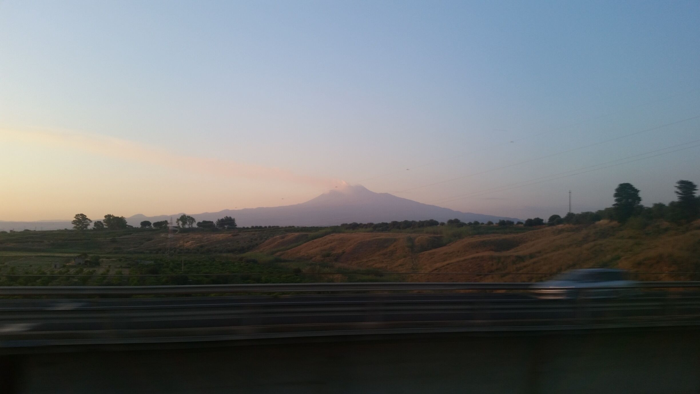 A mountain in the distance with a clear sky.
