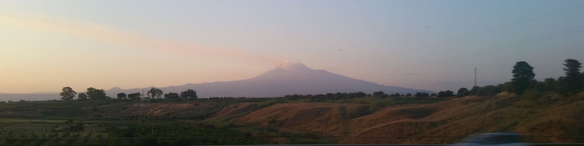 A mountain in the distance with a clear sky.