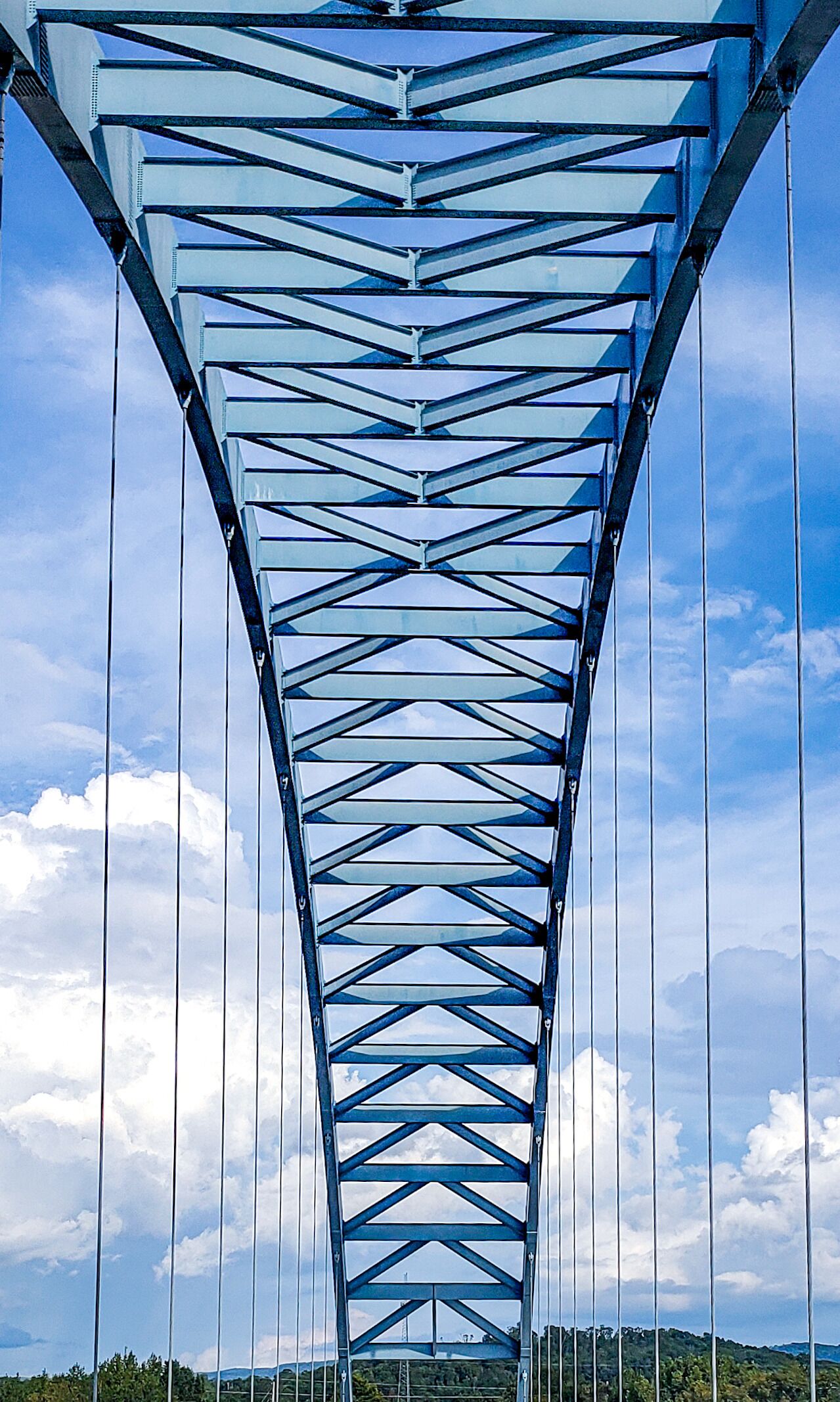 Stunning bridge in the middle of nowhere,  surrounded by mountains,  very scenic.