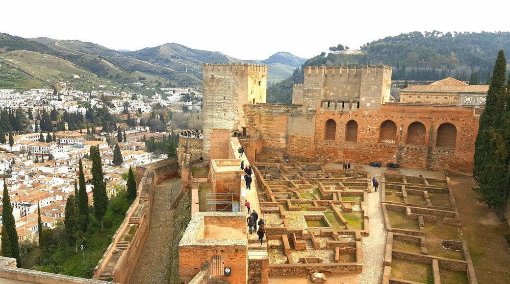 Almodovar castle on right and Andalucian town at the foot of the hill on the left