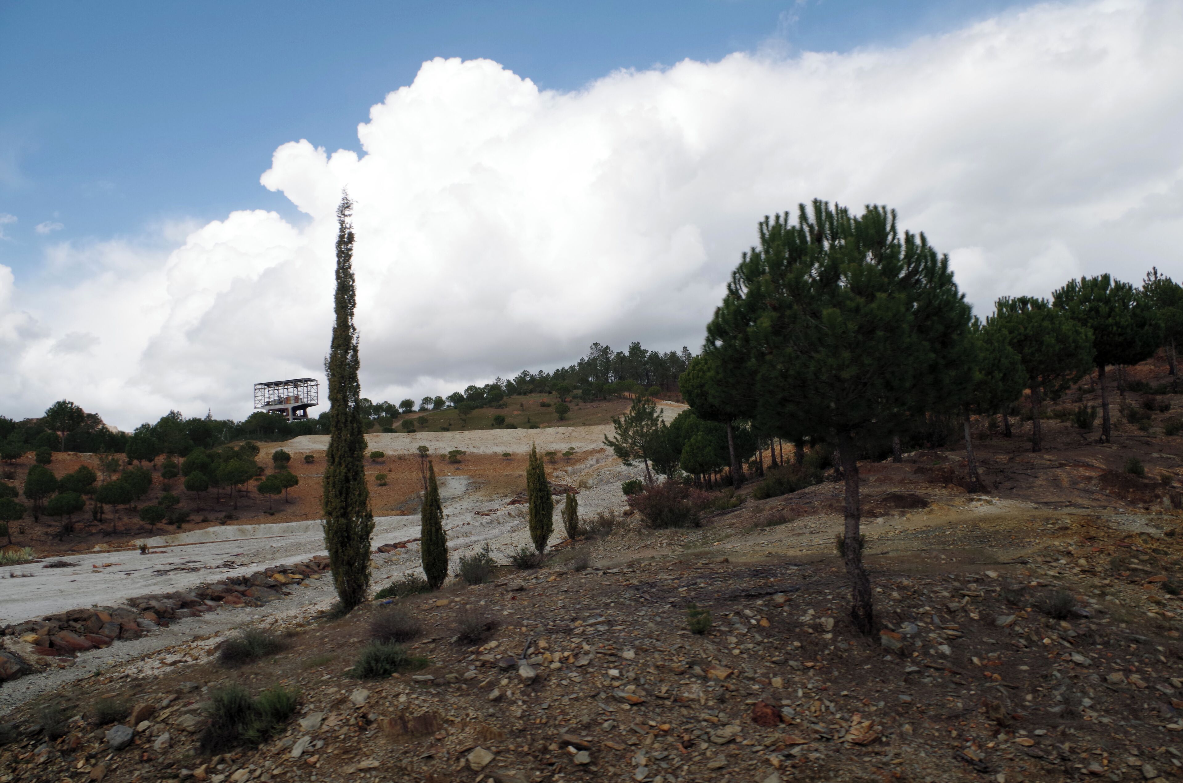 Landscape with mining winches in the road to the touristic mining train in Nerva. (Huelva, Spain)