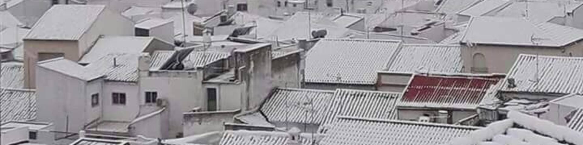 A very rare view of a snow bound Pruna. Rooftop pic of Castillo Hierro