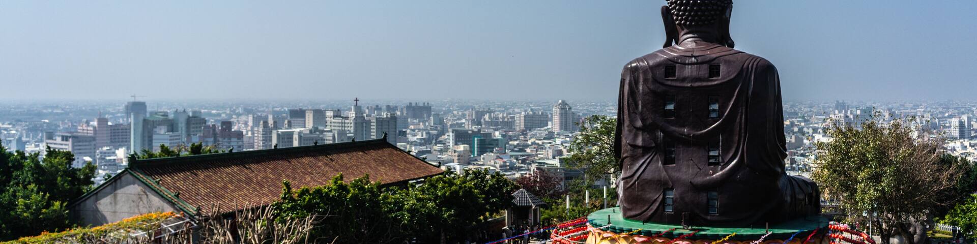 Baguashan great Buddha statue from mount Bagua and Changhua cityscape panorama in background in Taiwan