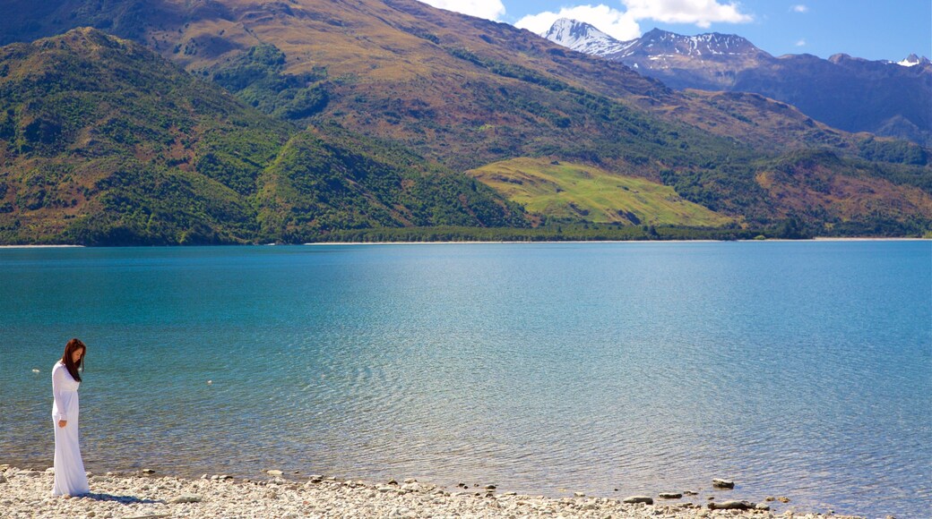 Wanaka which includes a lake or waterhole and mountains as well as an individual femail