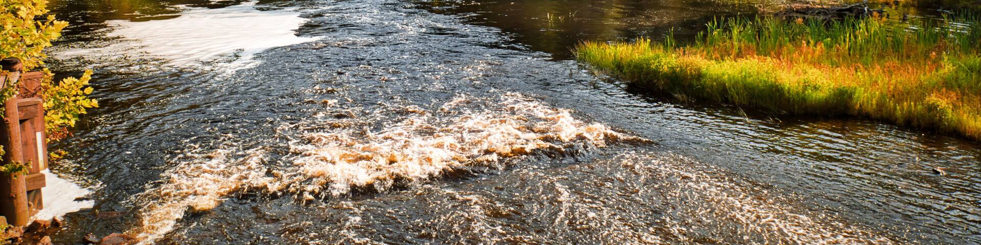 View of the waterfalls and lake behind the saw mill in the historic Batsto village, located in the Pine Barrens, New Jersey, USA