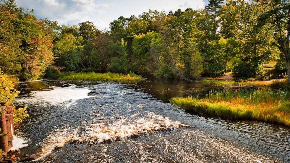 View of the waterfalls and lake behind the saw mill in the historic Batsto village, located in the Pine Barrens, New Jersey, USA