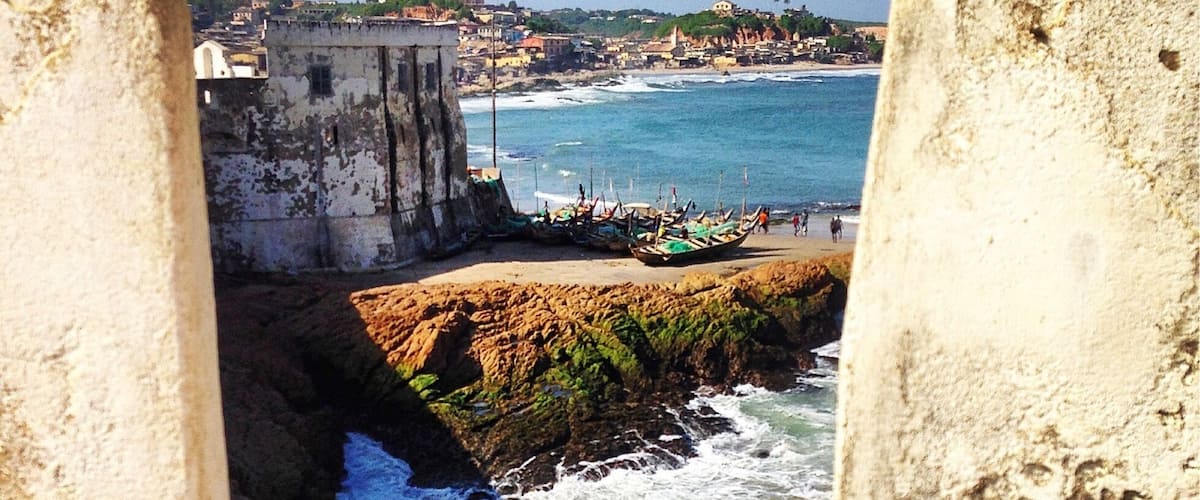 Cape Coast Castle is one of approximately forty fortresses built along the Gold Coast of West Africa by Europeans. Originally built by the Swedes for trading for timber and gold, the fort passed into the hands of the Dutch, followed by the British during which time the fort became infamously associated with the emergent slave trade. Today it serves as a stark reminder of that tragic period in history.