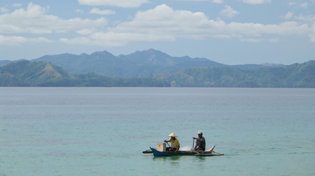 Arrived at our destination around noon. Since the sun is still making its way out of the coming dark clouds, I tried to enjoy the view then took a picture of these two fishermen.