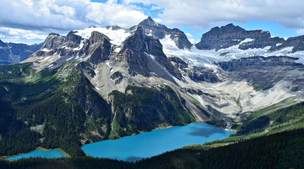 What could be a better weekendgetaway than a trip to Canmore, Alberta, and a helicopter tour over the Rockies? We took the 30 -minute Mount Assiniboine tour with Alpine Helicopters in Canmore. Here, you see Marvel and Gloria Lakes in the foreground and Aye Mountain, just across the border in British Columbia. They give you headphones, with microphones to talk during the tour, but we were simply speechless!!
More story & photos at: http://www.travelblissnow.com/a-spectacular-helicopter-tour-over-the-canadian-rockies/