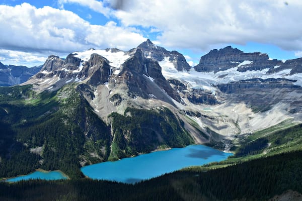 What could be a better weekendgetaway than a trip to Canmore, Alberta, and a helicopter tour over the Rockies? We took the 30 -minute Mount Assiniboine tour with Alpine Helicopters in Canmore. Here, you see Marvel and Gloria Lakes in the foreground and Aye Mountain, just across the border in British Columbia. They give you headphones, with microphones to talk during the tour, but we were simply speechless!!
More story & photos at: http://www.travelblissnow.com/a-spectacular-helicopter-tour-over-the-canadian-rockies/