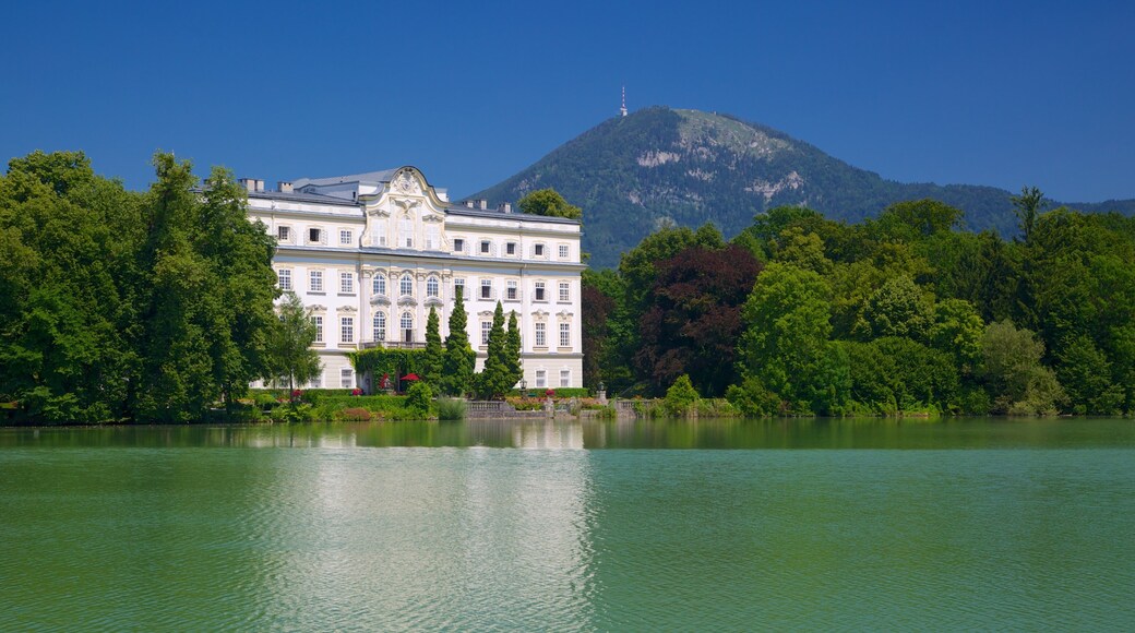 Salzburg which includes a house, heritage elements and a lake or waterhole