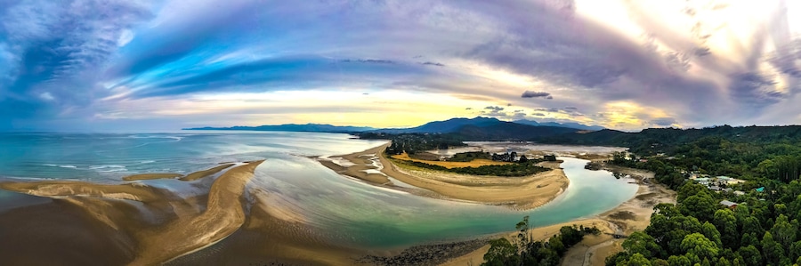 Ultra wide HDR Panorama of River estuary with mountains in the background