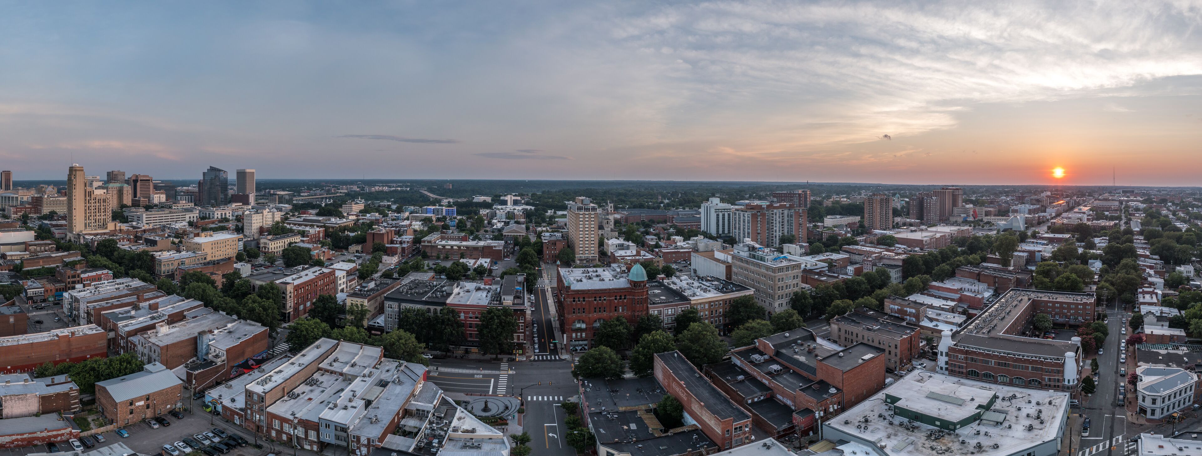 Aerial sunset view of Richmond capital city of Virginia with dramatic sky overlooking the fan district and monroe ward, main street 