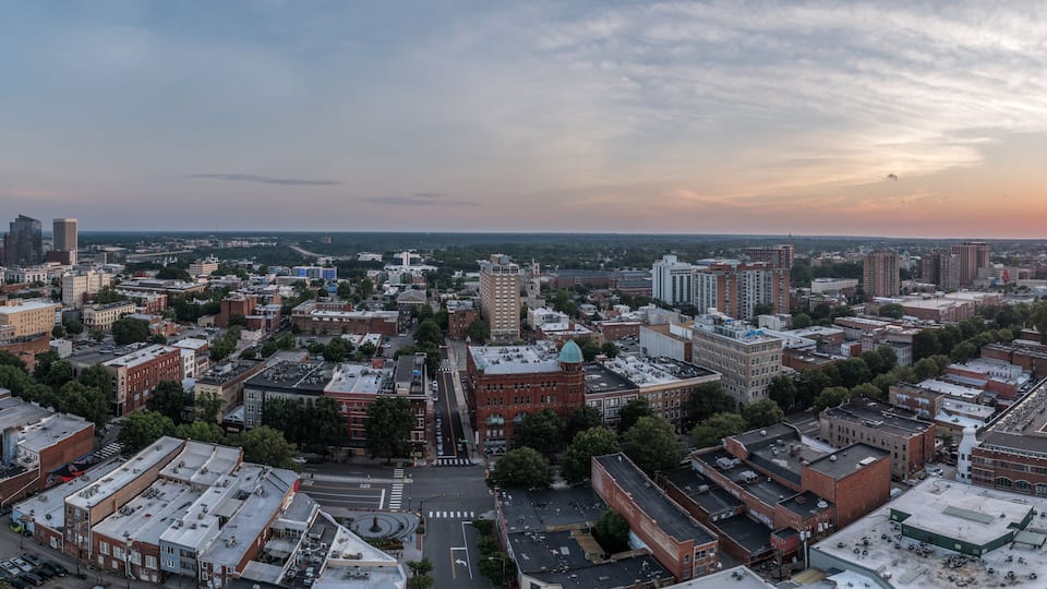 Aerial sunset view of Richmond capital city of Virginia with dramatic sky overlooking the fan district and monroe ward, main street