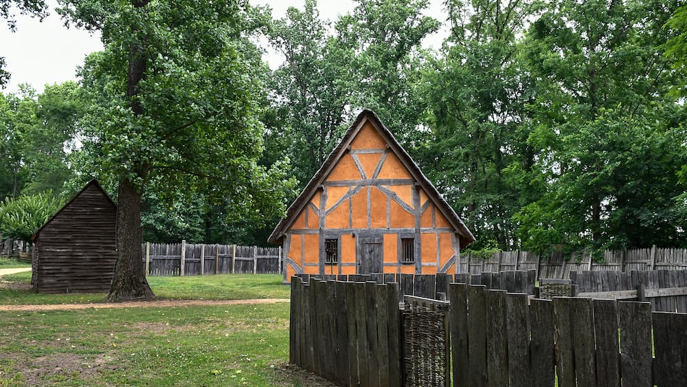 Orange house with wooden fence, Early Settlement Interpretive, Henricus Historical Park, Chester, Virginia