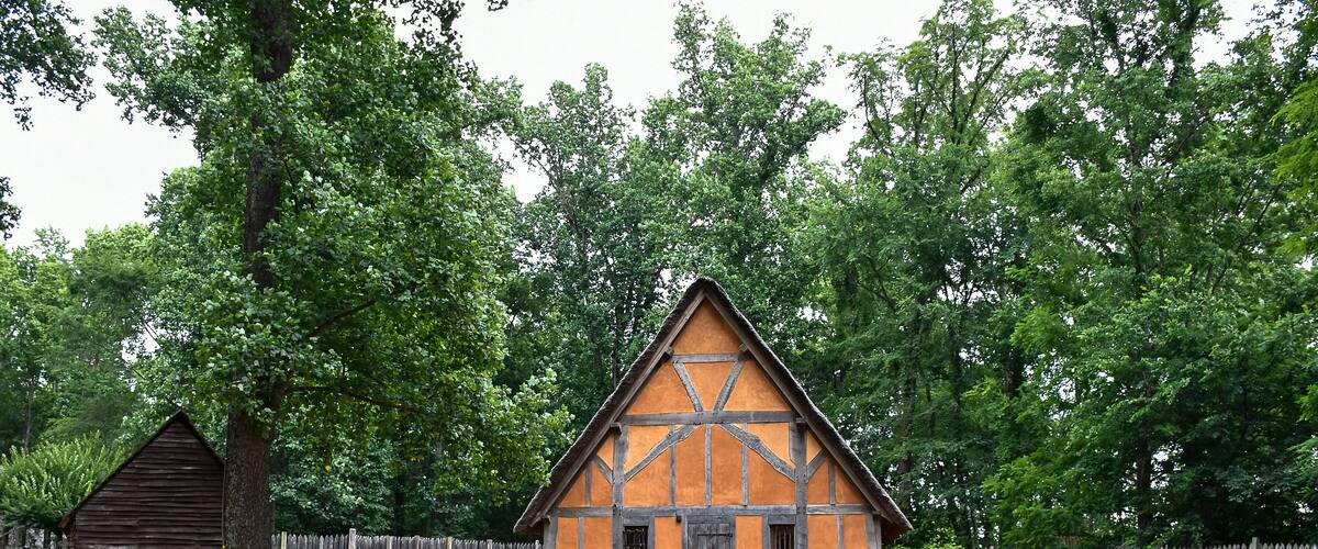 Orange house with wooden fence, Early Settlement Interpretive, Henricus Historical Park, Chester, Virginia