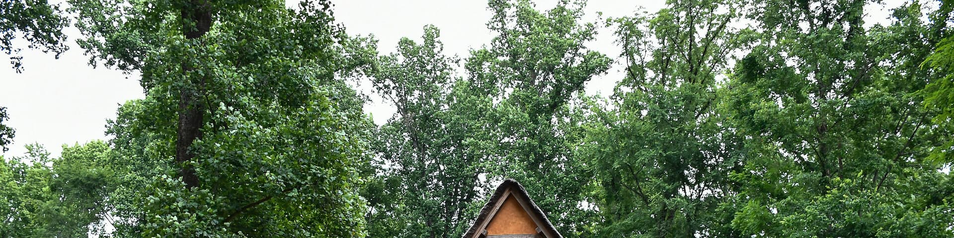 Orange house with wooden fence, Early Settlement Interpretive, Henricus Historical Park, Chester, Virginia