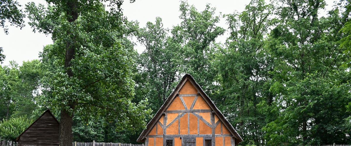 Orange house with wooden fence, Early Settlement Interpretive, Henricus Historical Park, Chester, Virginia
