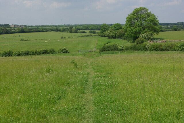 Footpath to Hungary Hall The footpath crosses open country west of Olney; here it is heading down into the valley of a minor tributary of the River Great Ouse.