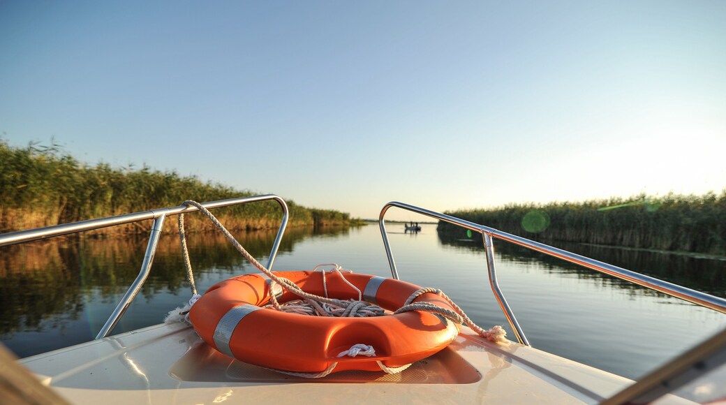 sunset in the Danube delta Romania.Beautiful blueish lights in water.Beautiful sunset landscape from the Danube Delta Biosphere Reserve in Romania
