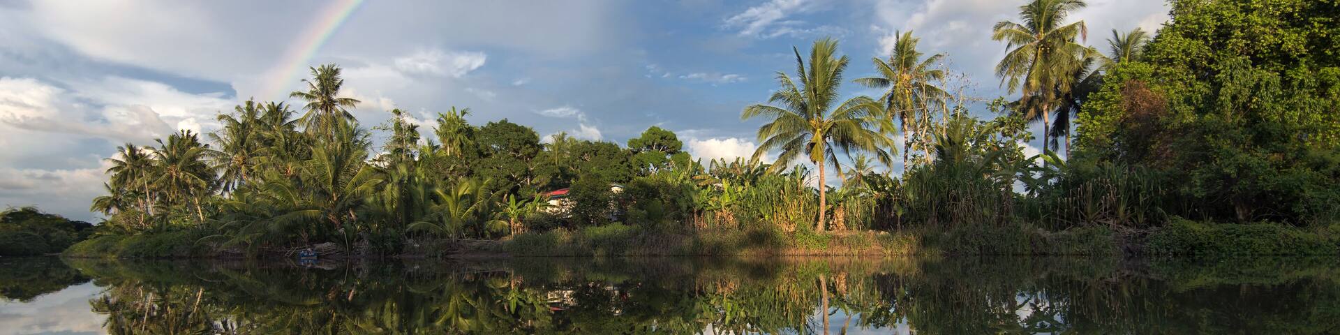 The reflect of rainbow in Kinabantangan river. Borneo