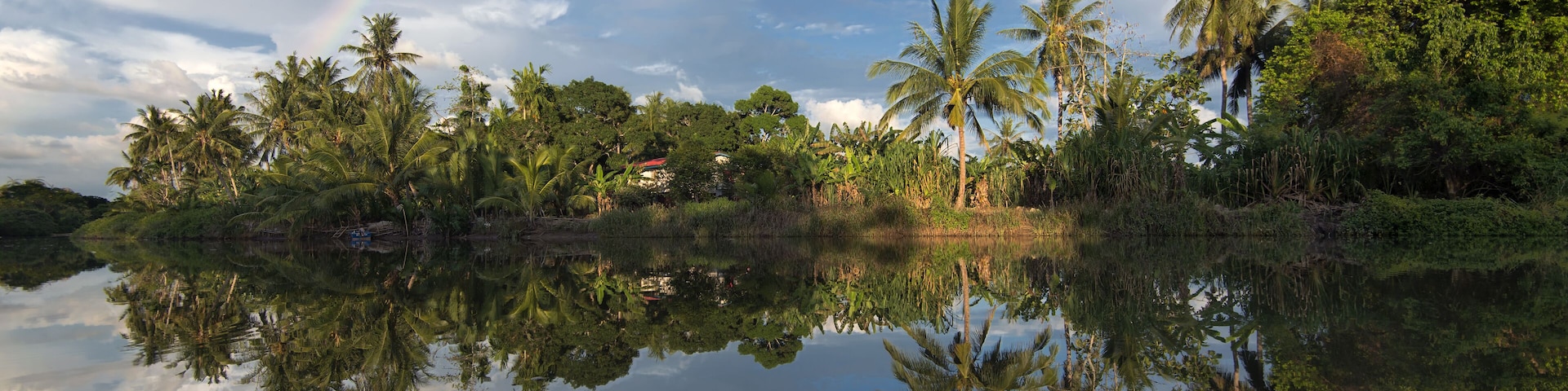 The reflect of rainbow in Kinabantangan river. Borneo