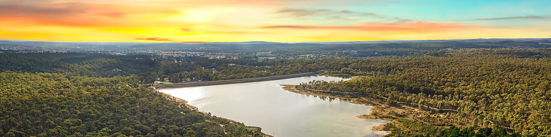 Sunrise at Crusoe Reservoir, Bendigo. Dramatic red skies over luscious green forest, pristine nature and open landscapes in Central Victoria.
