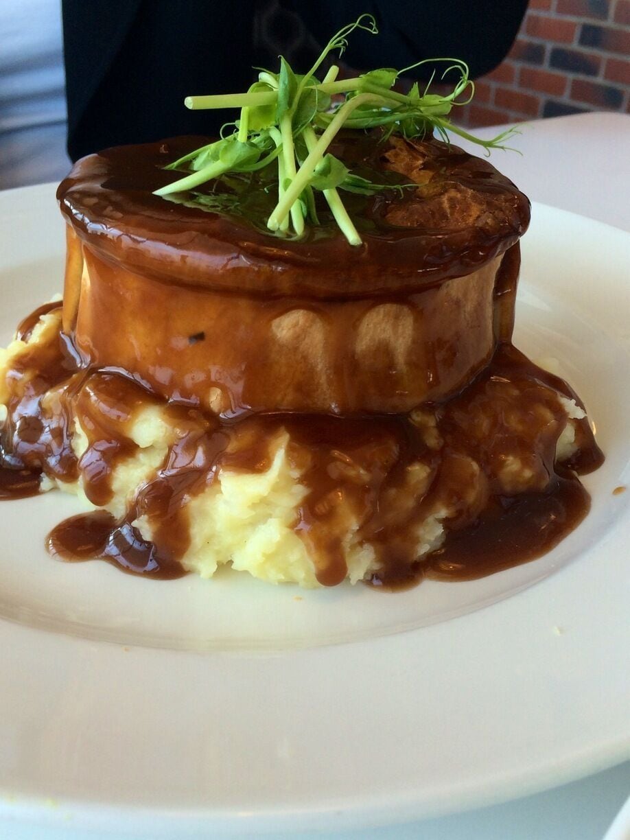 Very cute cafe decorated in pictures of red buses, Victorian wallpaper, English waitresses and a very English menu. 

Steak and red wine pie- $22

Mains around $22 for lunch and $15-$22 for breakky. 