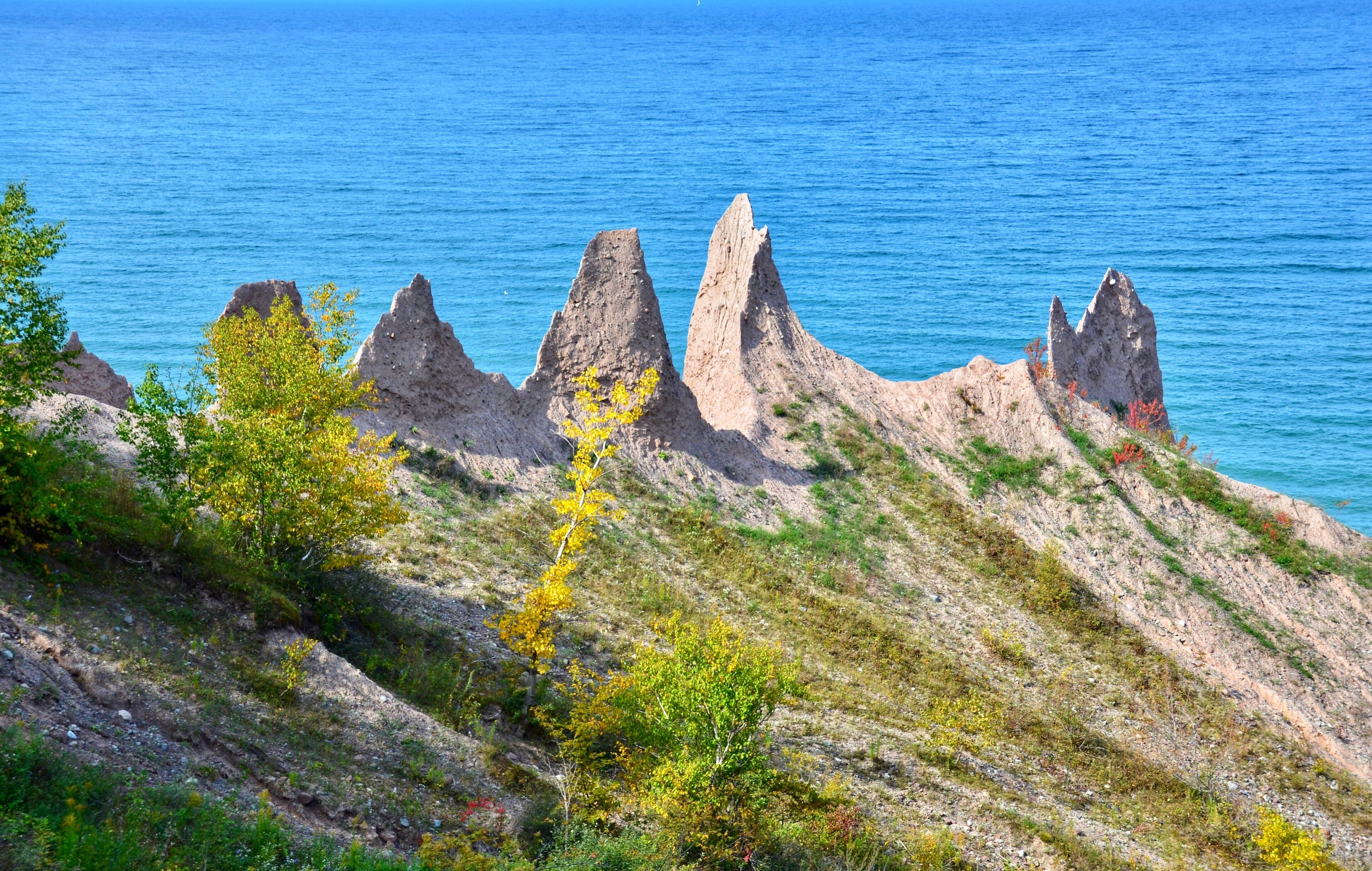 Chimney Bluffs State Park, New York. It’s situated on the southern shore of Lake Ontario, east of Sodus Bay. From the park's hiking trails, you can view the large clay formations at the water's edge