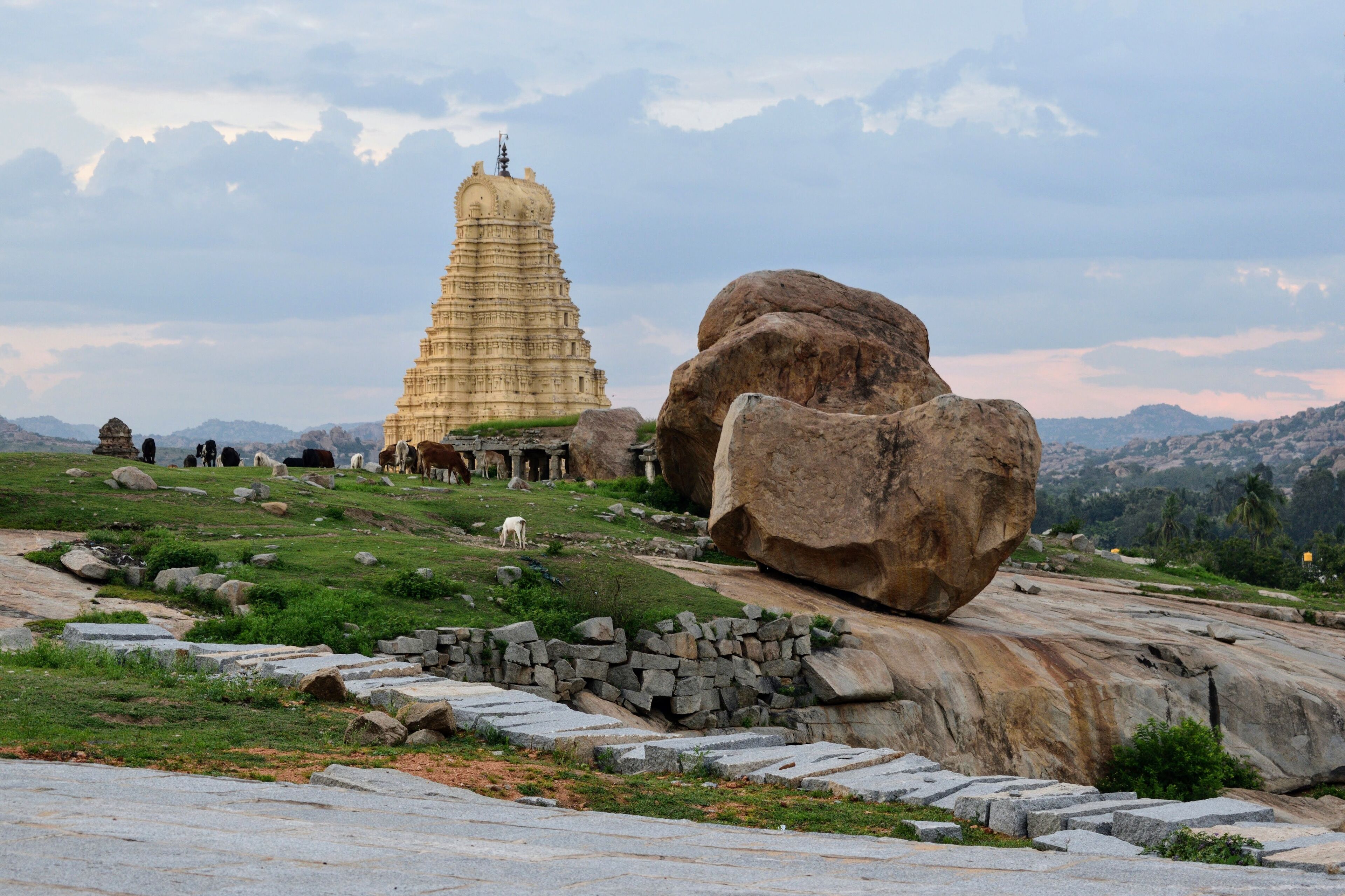 The glorious and still active Virupaksha temple in Hampi shines on in the background. As you relax on the Hemakuta hill slopes enjoying this view, the devotional chants reverberating from the temple will transport you to a magical, peaceful place. Truly, you need to experience that moment.