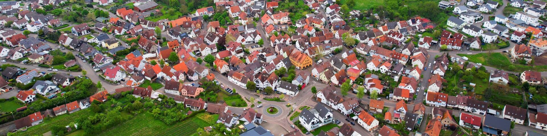 Aerial panoramic view around the old town of the city Cleebronn on a cloudy spring noon in Germany.