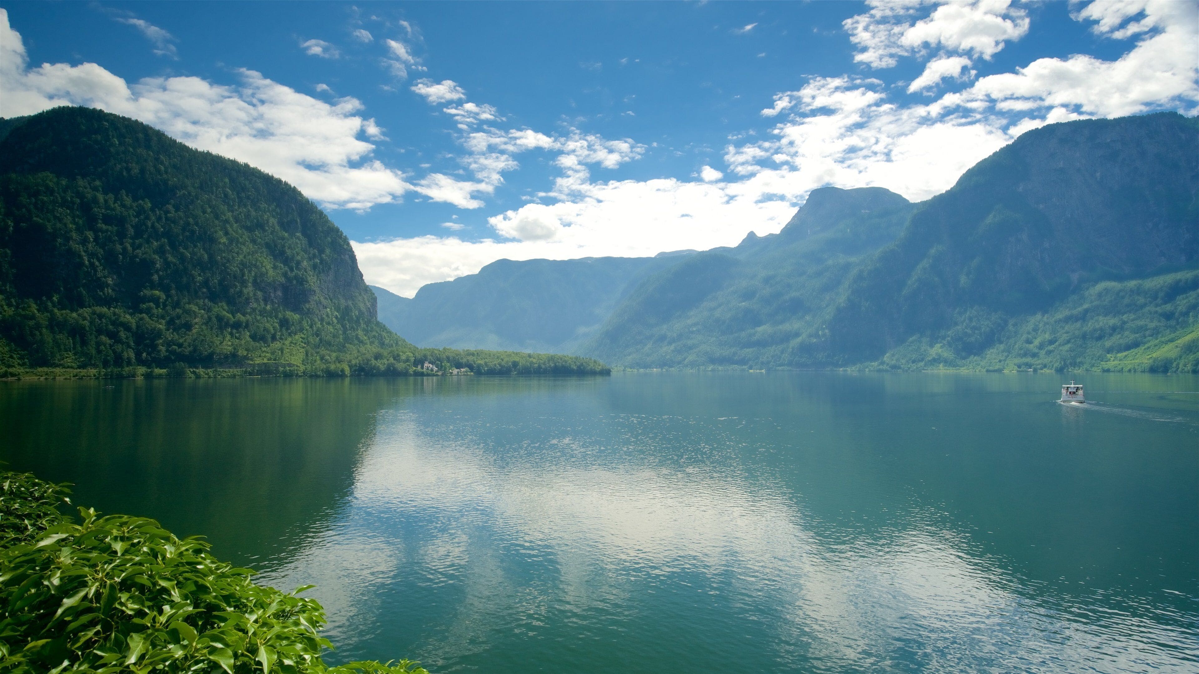 Hallstatt Lake featuring mountains, a lake or waterhole and tranquil scenes