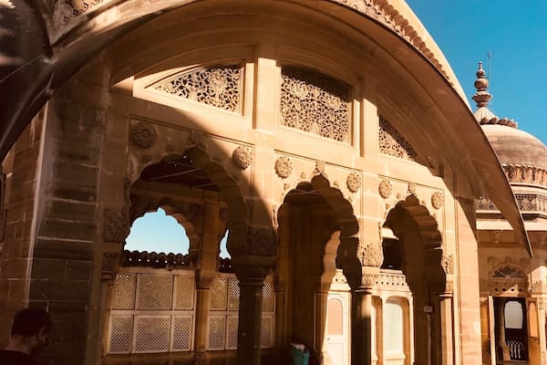 An ornate architectural structure with intricate carvings and domes.
