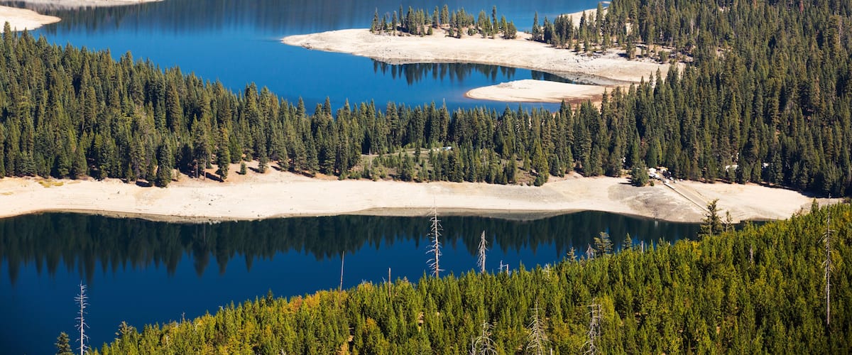 The ice house lake in drought conditions in the El Dorado National Forest, California, USA.