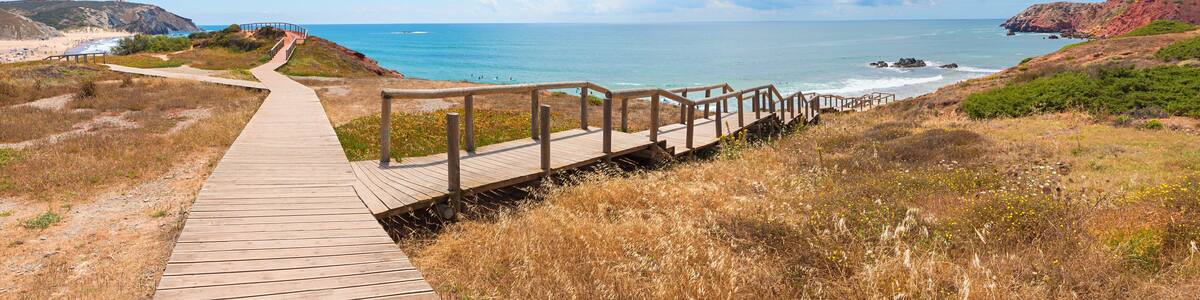 boardwalk to Amado surfing beach, West algarve, colorful Cliffs. landscape Portugal