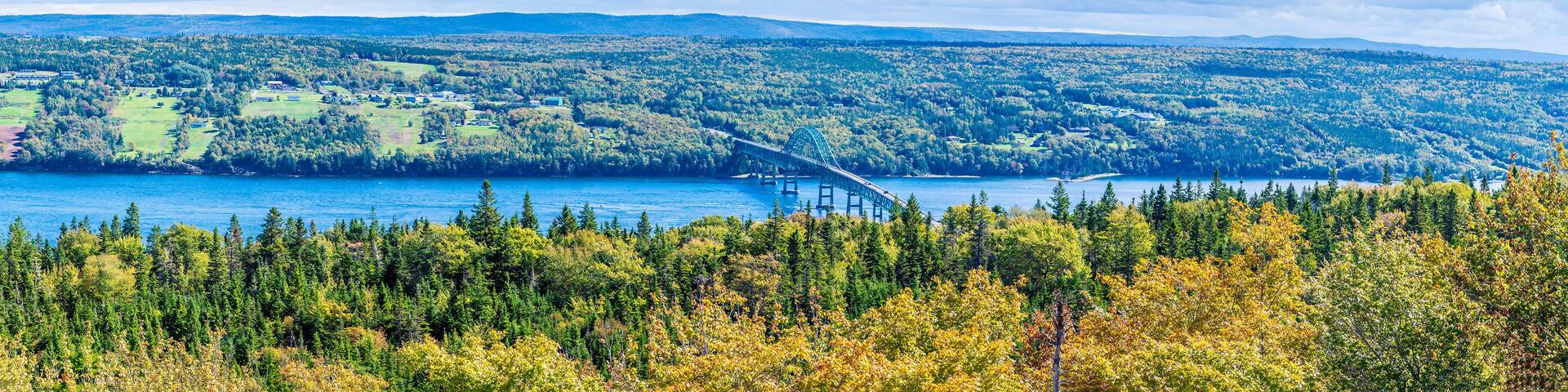 A panorama view down towards the Seal Island Bridge on the trans canada highway near Sydney, Nova Scotia, Canada in the fall