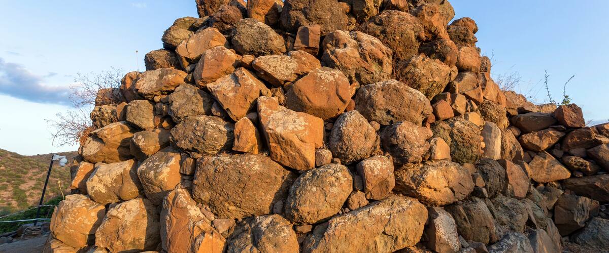 A large pile of rocks in a natural landscape.