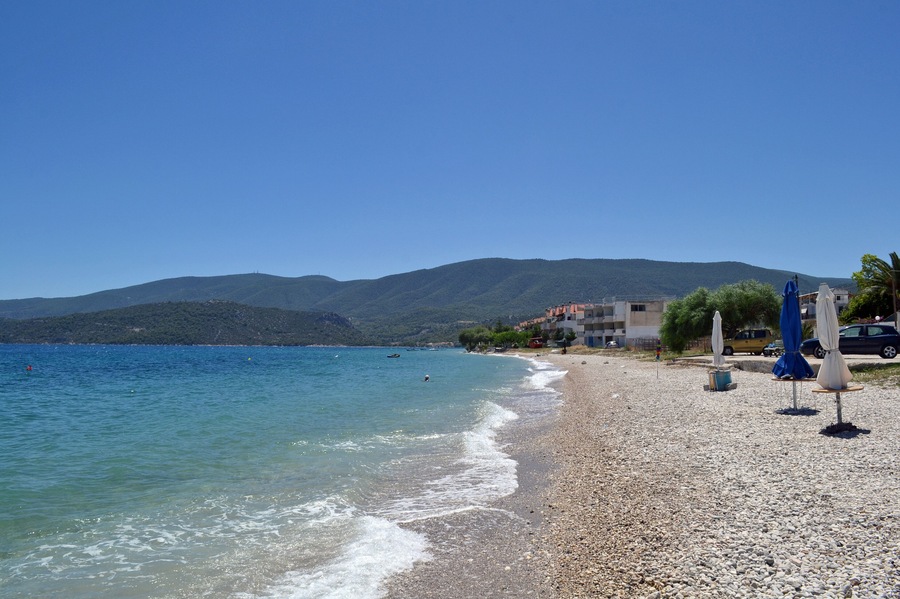Beach in Loutra Oraias Elenis meaning Baths of beautiful Helen, a village in Corinthia, Greece, situated on the coast of the Saronic Gulf.