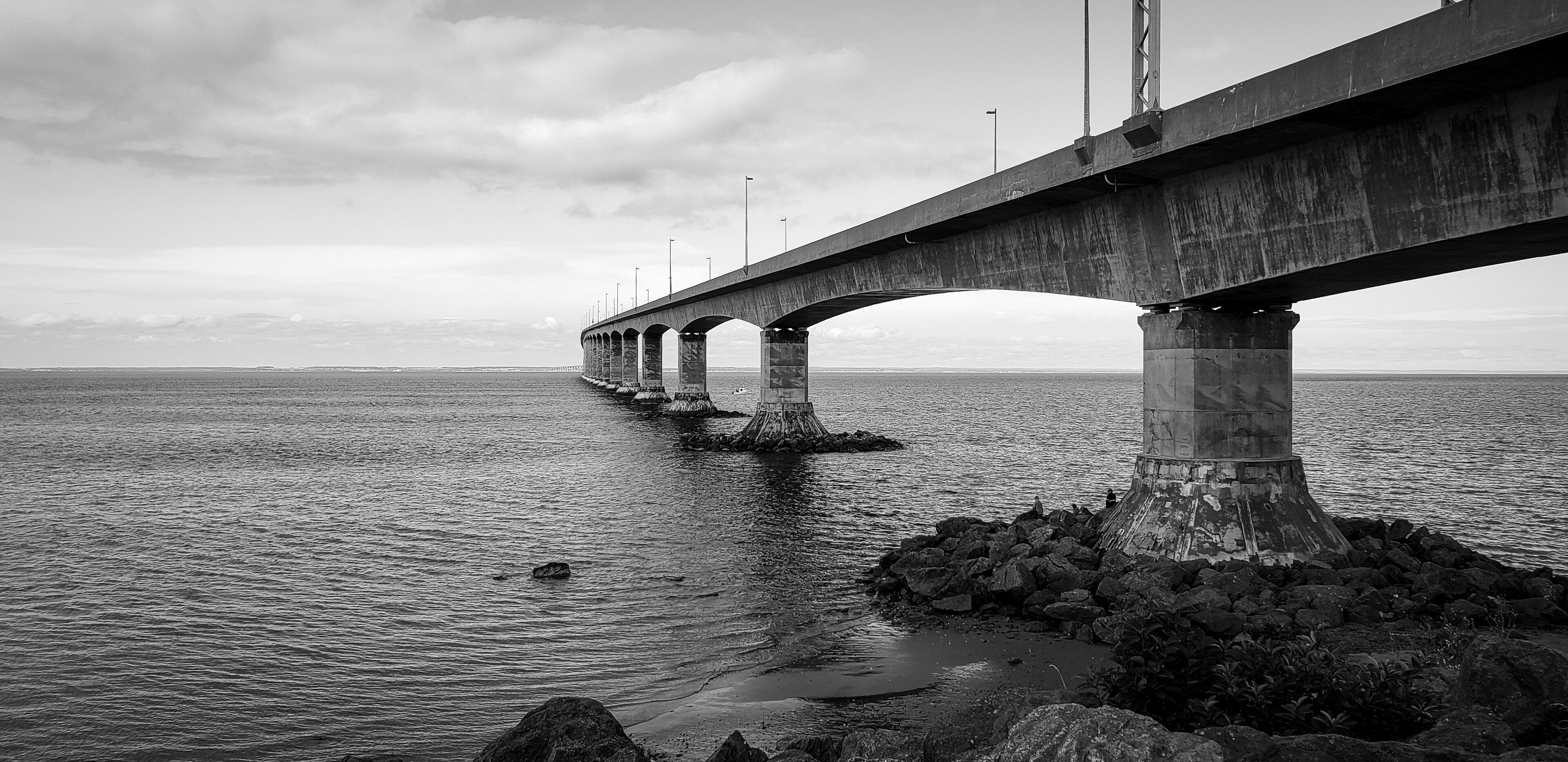 Confederation Bridge connects the mainland to Prince Edward Island. While it's free to drive across to the island, the return trip will cost you approx. $50 for a car and more if you are driving a larger vehicle. It's length totals 12.9 KM making it the world's largest bridge over ice covered water.