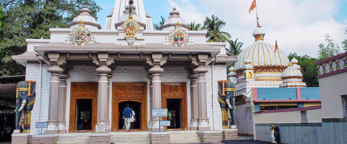 A temple with ornate architecture, including domes and statues.
