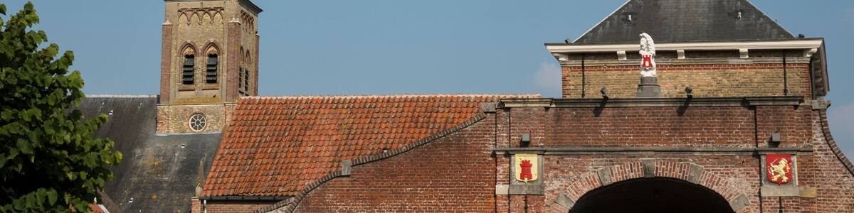 city gate called Kaaipoort in Aardenburg, The Netherlands. With towers. Blue sky, space for text