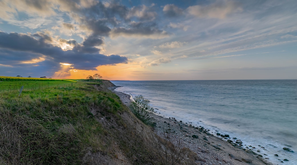 Breathtaking beautiful panorama view of wild romantic coastal cliff landscape at the Baltic Sea with rape fields in the background at the Wangels, Ostholstein,Schleswig-Holstein, Germany,
Hohwacht Bay